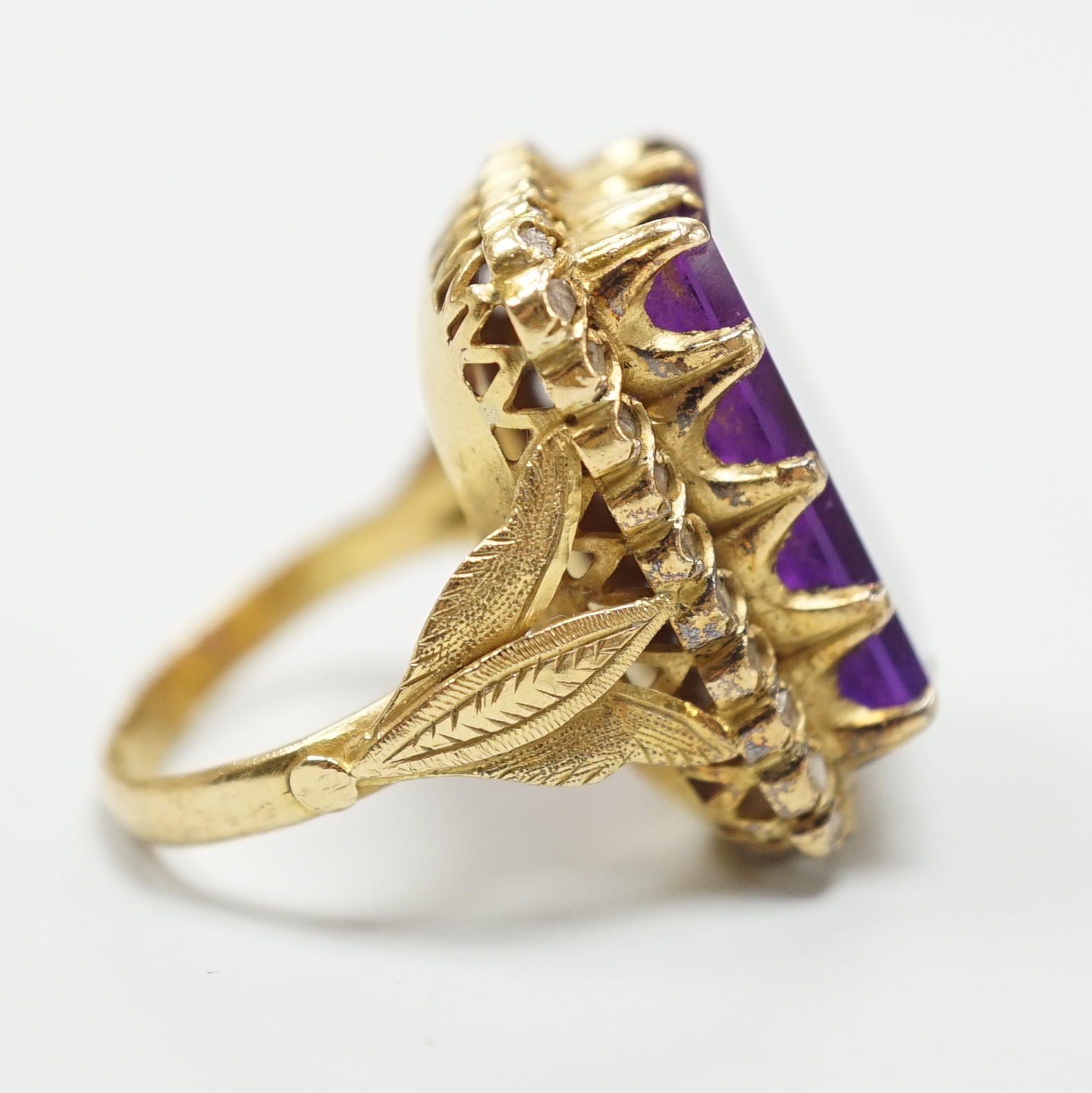 A Portuguese? yellow metal (stamped 800) and rectangular cut synthetic colour change corundum set dress ring, with diamond chip set border, size M, gross weight 13 grams.
